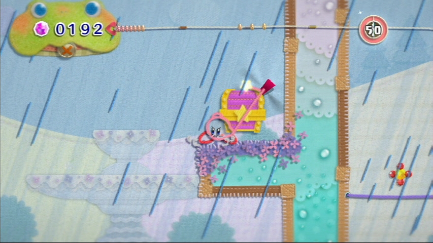 Kirby's Epic Yarn Toto je ona, truhlika s kovm predmetom. Vyskka hore trv vak dobr mintu.