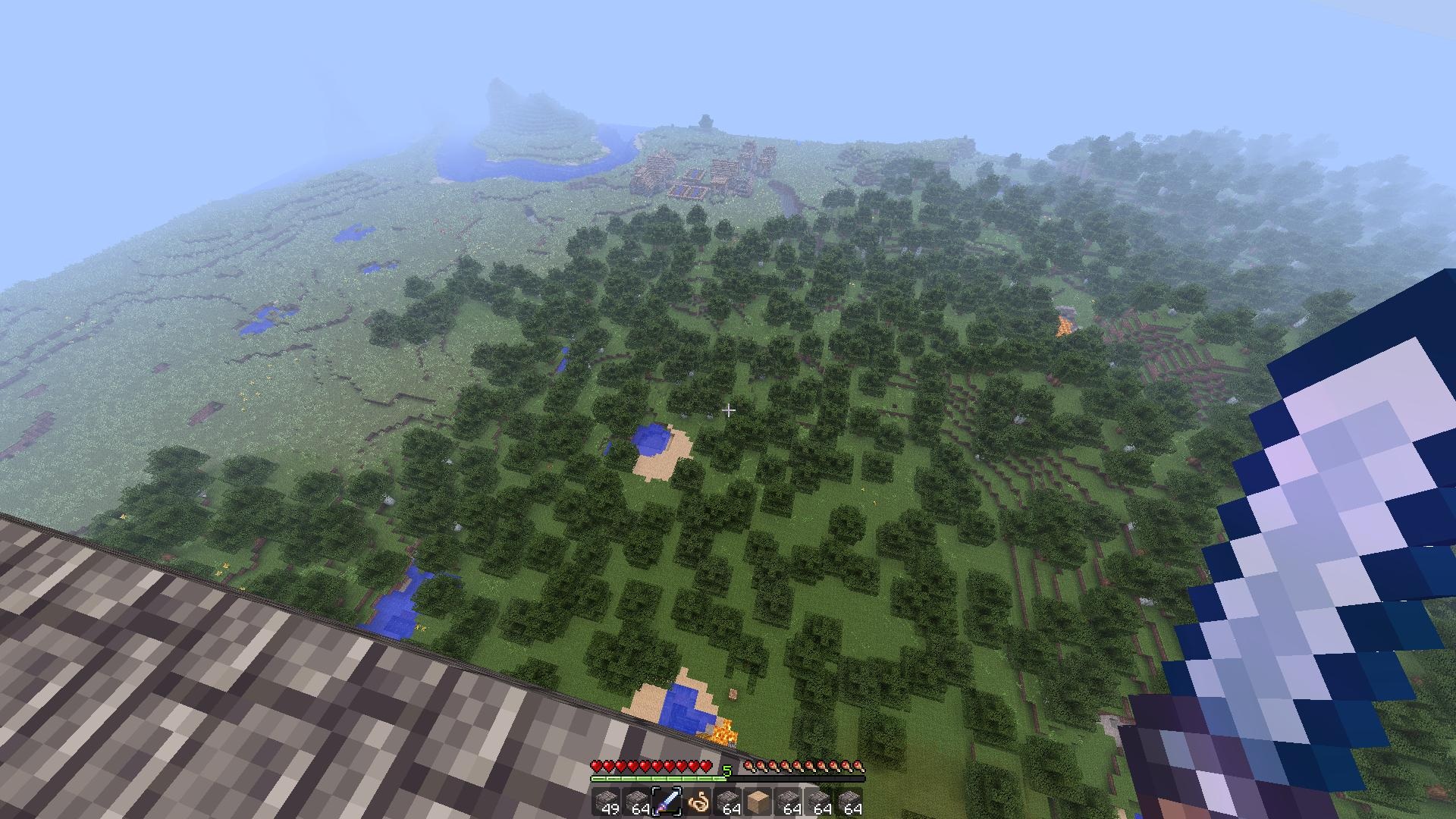 Minecraft Pohľad z veže na krajinu pod ňou. V diaľke sa črtá dedinka.