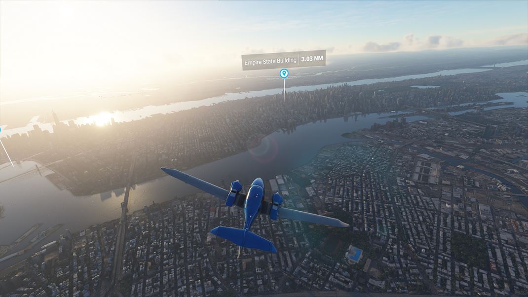 Microsoft Flight Simulator Východ nad mestom, vidno aj tiene, ktoré vrhajú jednotlivé mrakodrapy.